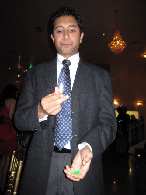 Krishna juggling finger lights at Lindsey's wedding, 2011